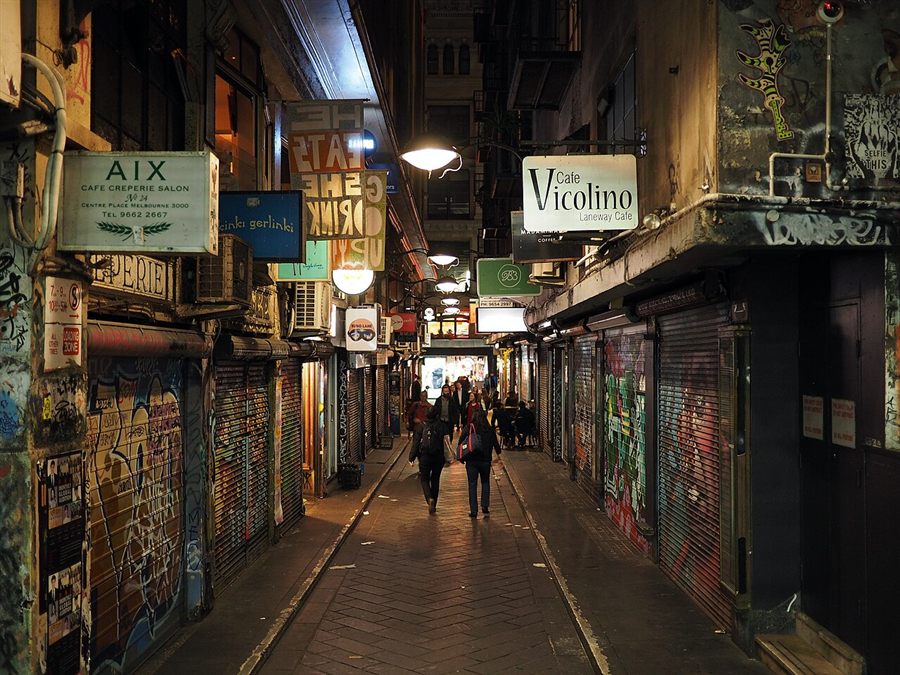 The narrow Centre Place laneway lit up at night